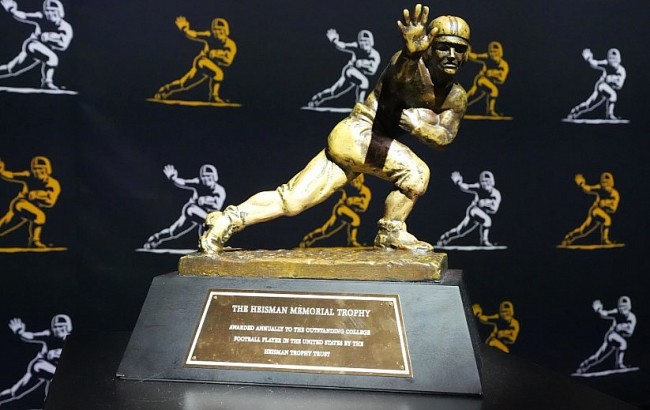 Who is John Heisman and What is the Heisman Memorial Trophy?