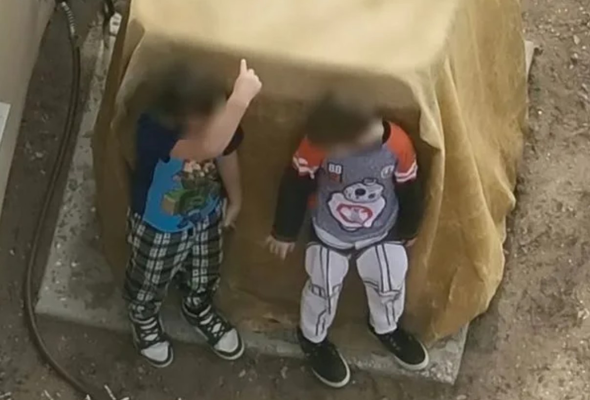 Brothers Aged 7 and 9 in Armed Police Standoff Caught on Video